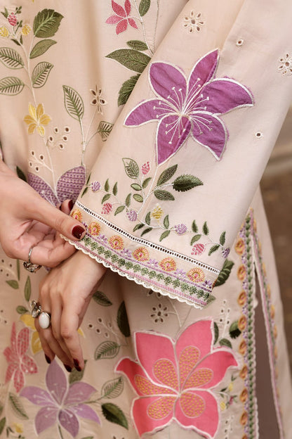 (close-up sleeve): "Close-up of floral embroidery on lawn suit sleeve"
